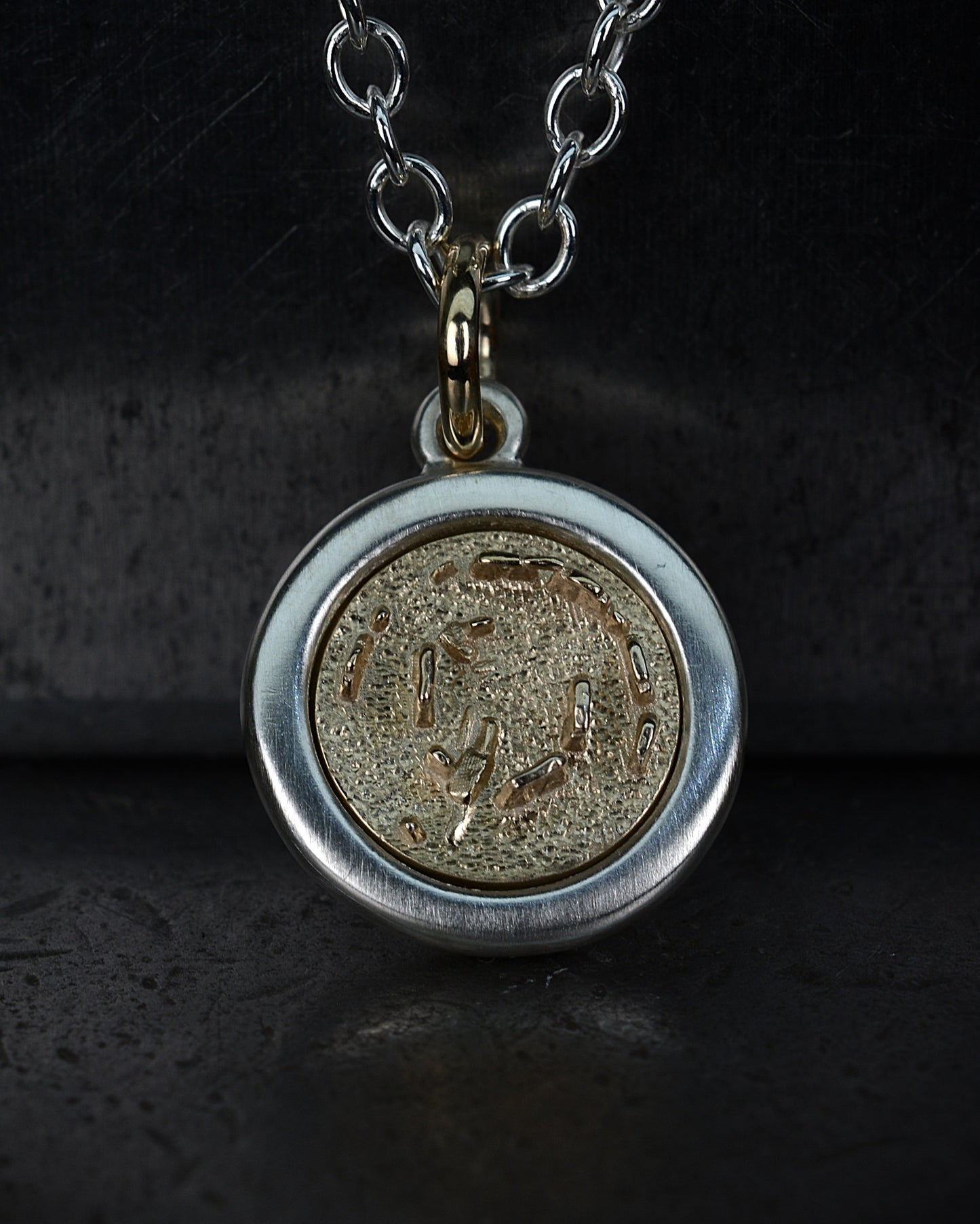 Gold and silver Stonehenge pendant and earring set. *These pieces are ready to be shipped.* © Adrian Ashley