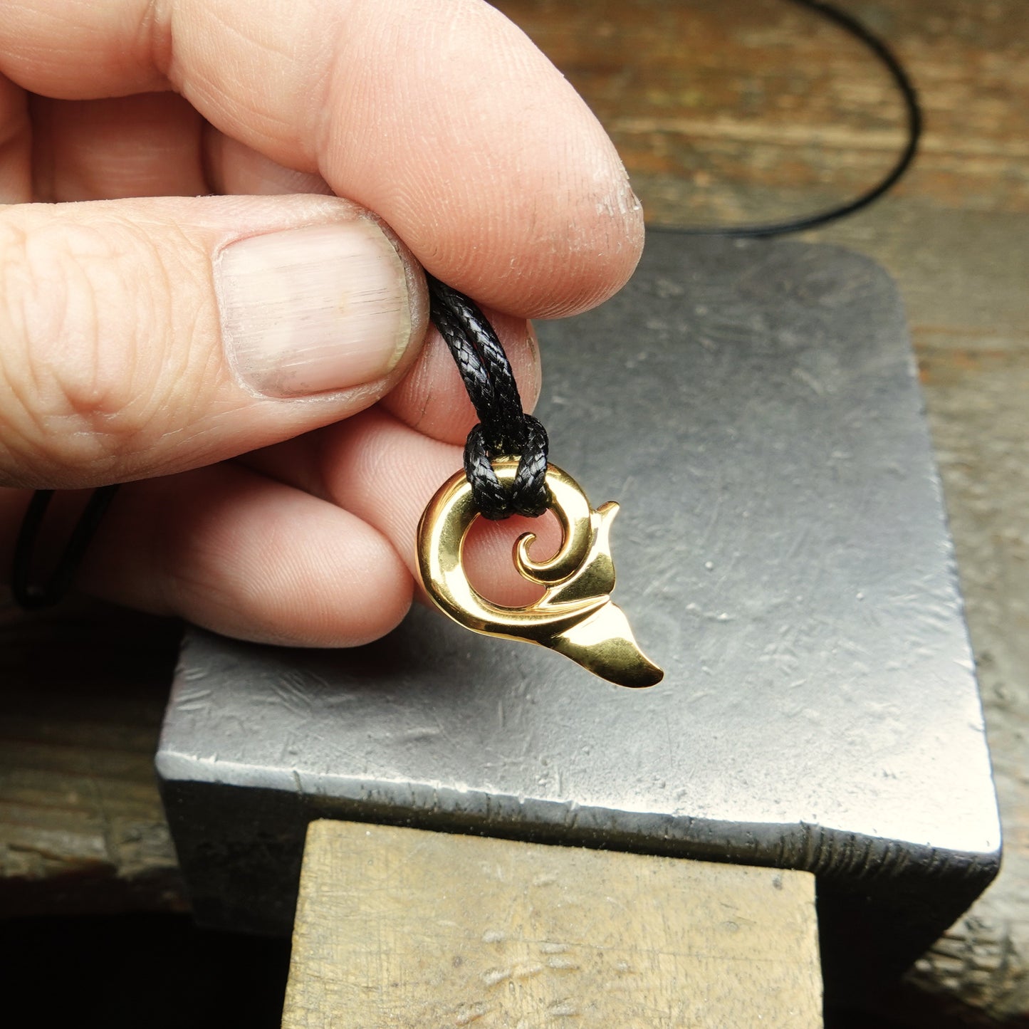 Whale tail necklace. Solid yellow gold whale fluke design.