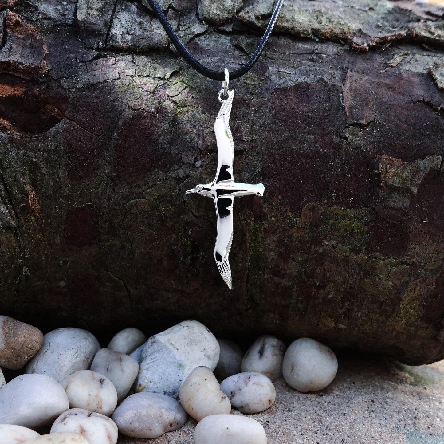 Albatross necklace. Made from highly polished, tarnish resistant silver, strung on a strong cord. © Adrian Ashley