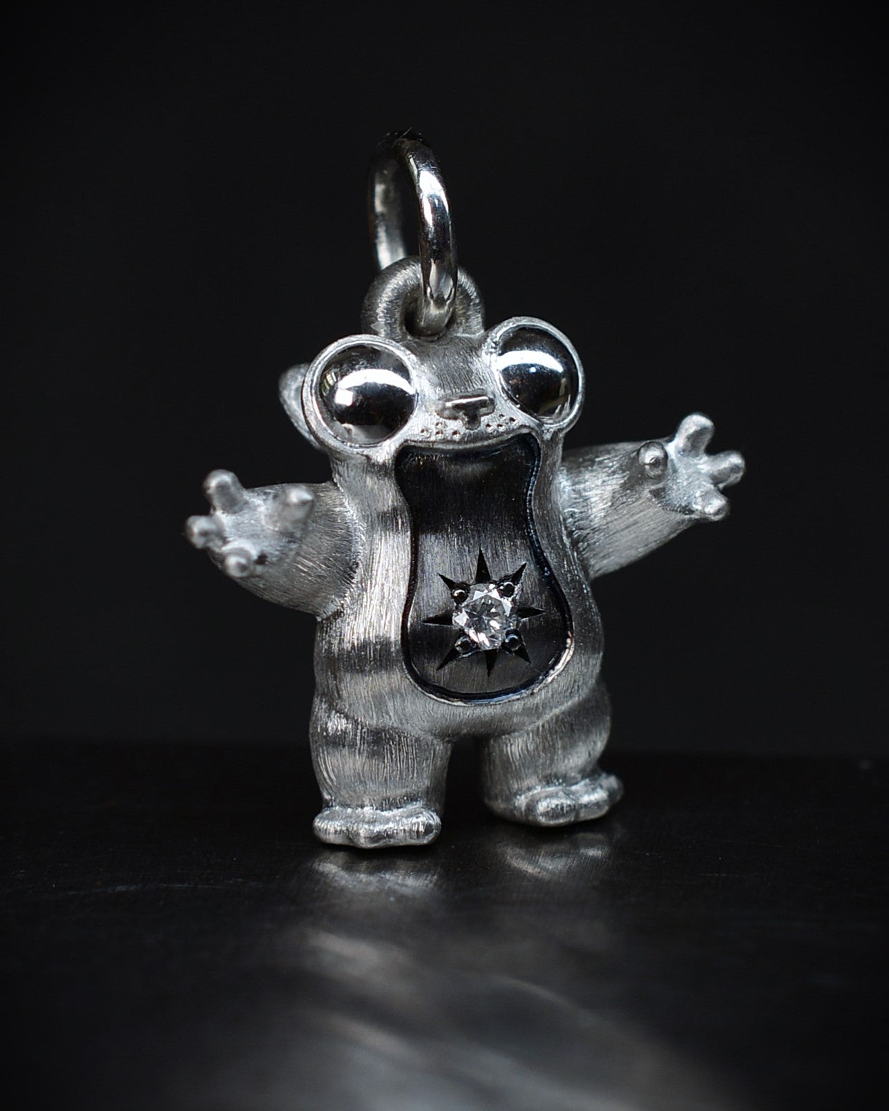 Black Star tarsier type Bright Creature with a diamond and black rhodium.