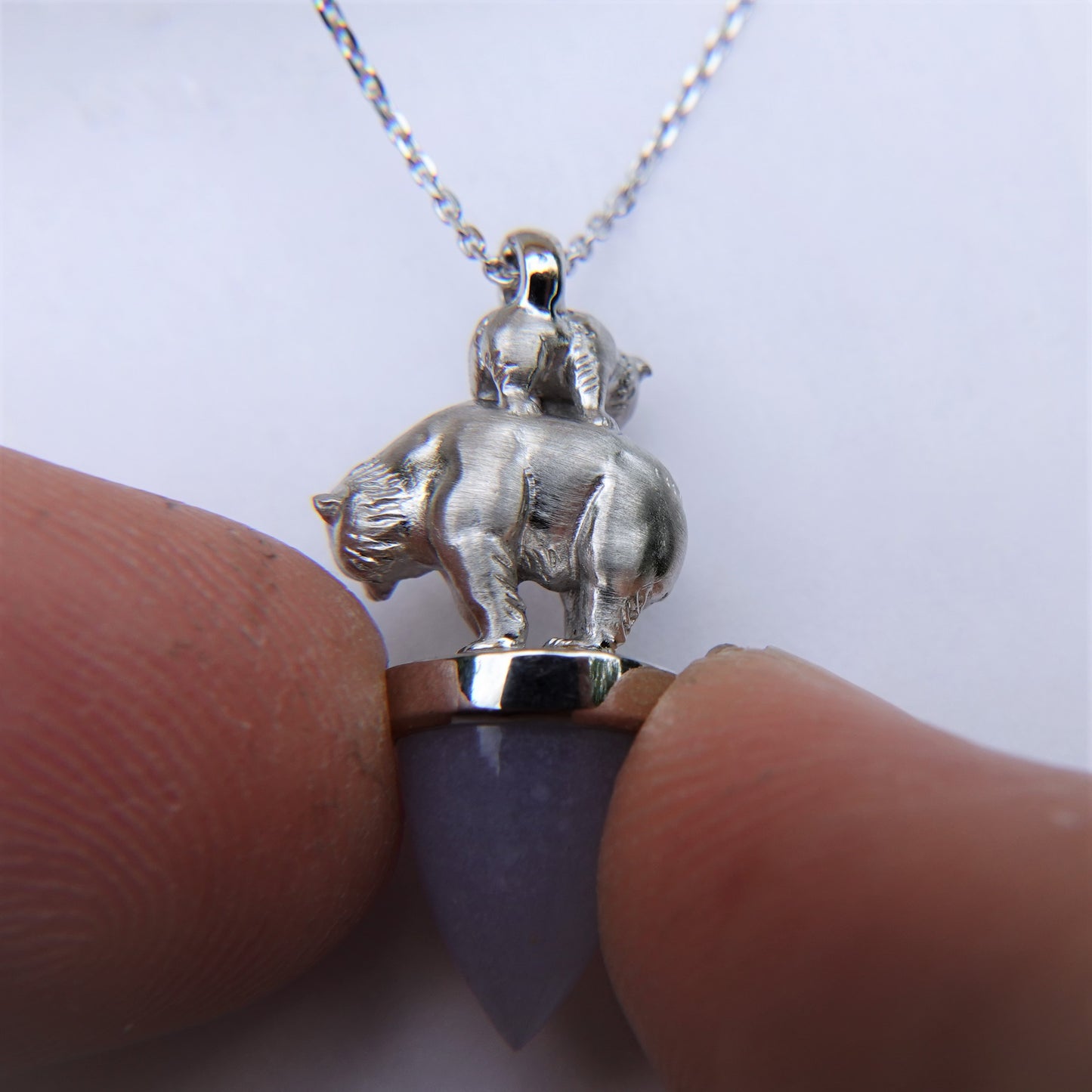 Polar bear and child necklace. Solid white gold bears on a blue Chalcedony gemstone, with a white gold chain. *This piece is finished and ready to be shipped*