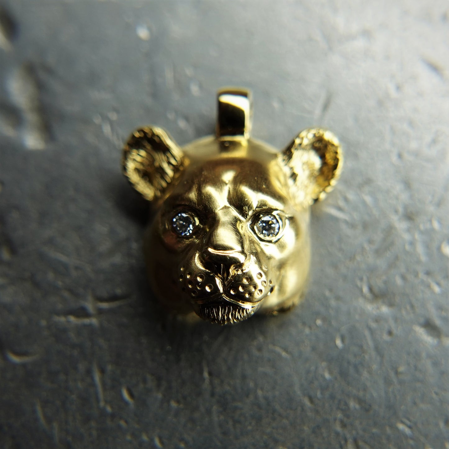 Little gold lioness necklace. Lioness head pendant and solid gold chain with diamond eyes. Handmade to order. © Adrian Ashley