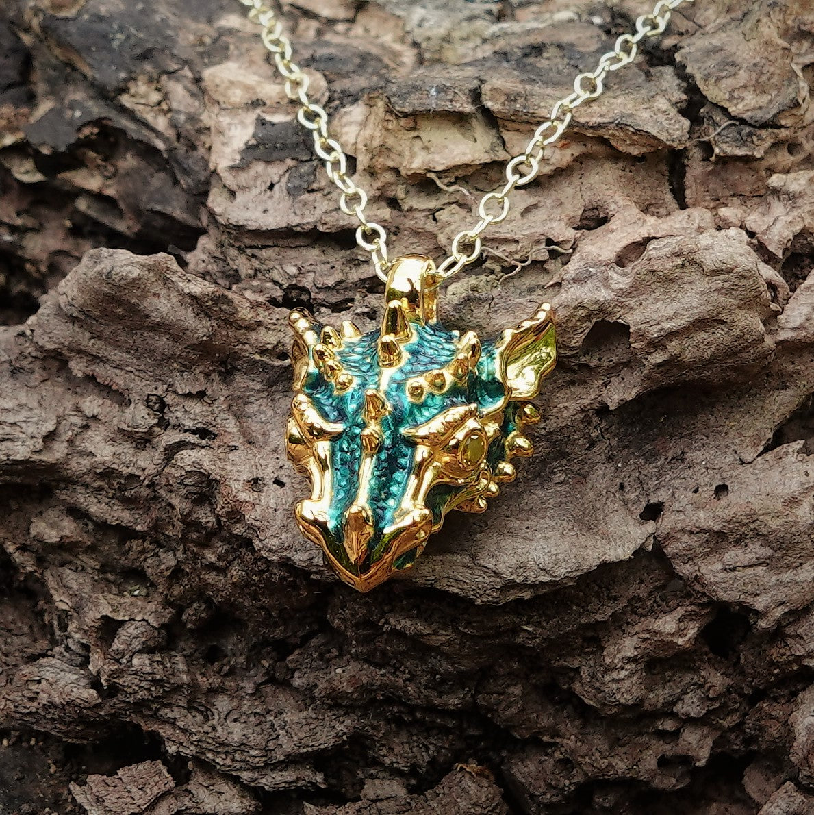 Dragon's head. Gold with diamond eyes and a gold chain. Handmade to order. © Adrian Ashley