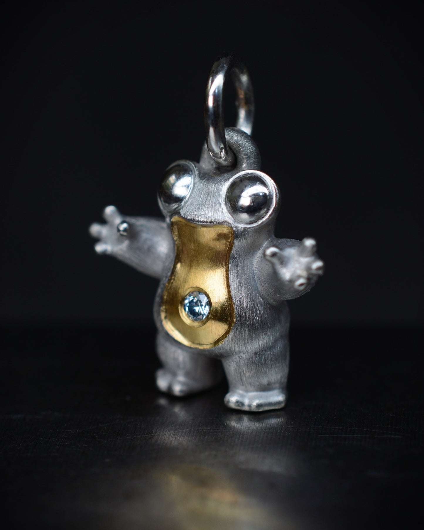 Small frog type Bright Creature with a diamond and parcel gilt.