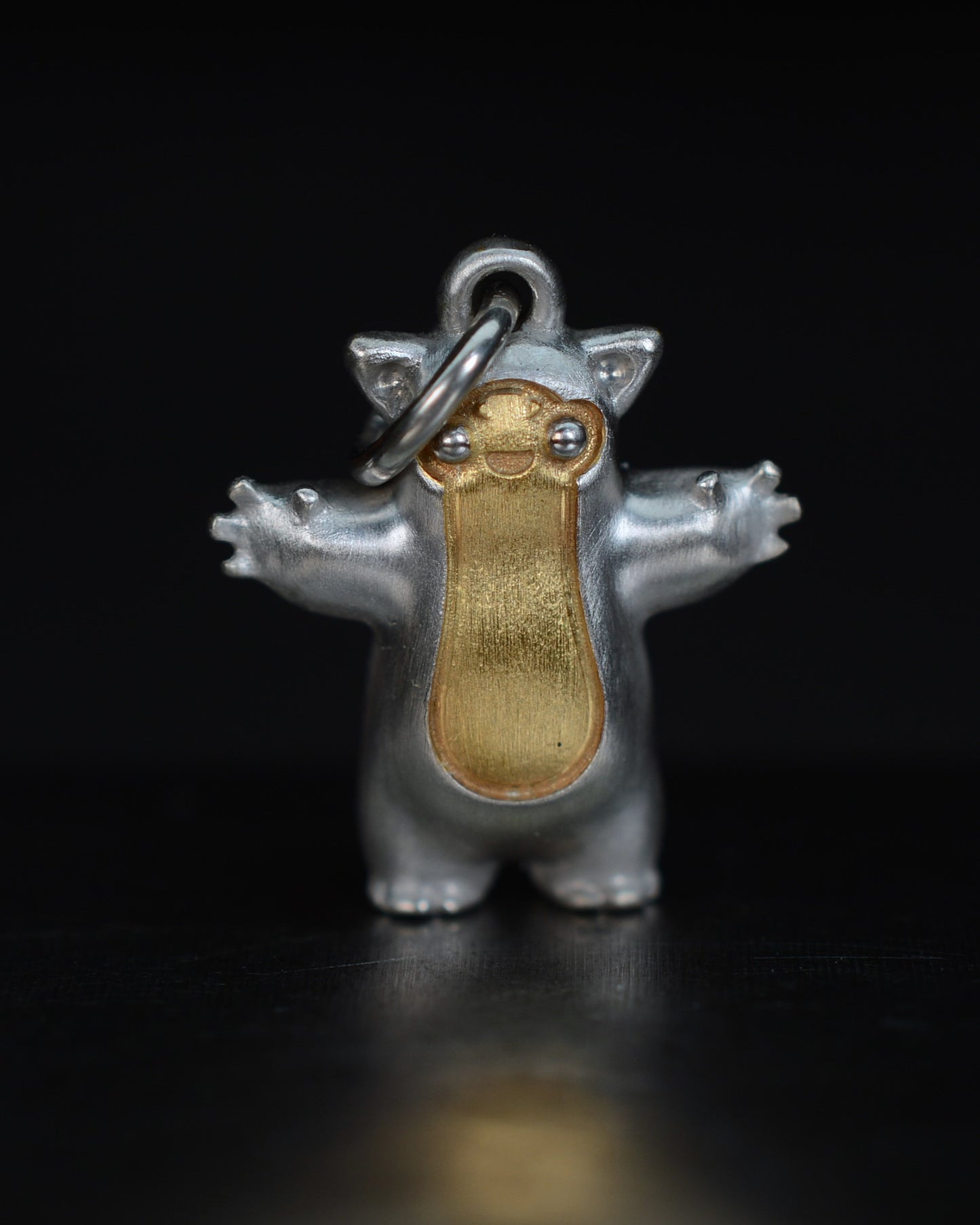 Fox eared small pearshape Bright Creature with parcel gilt.