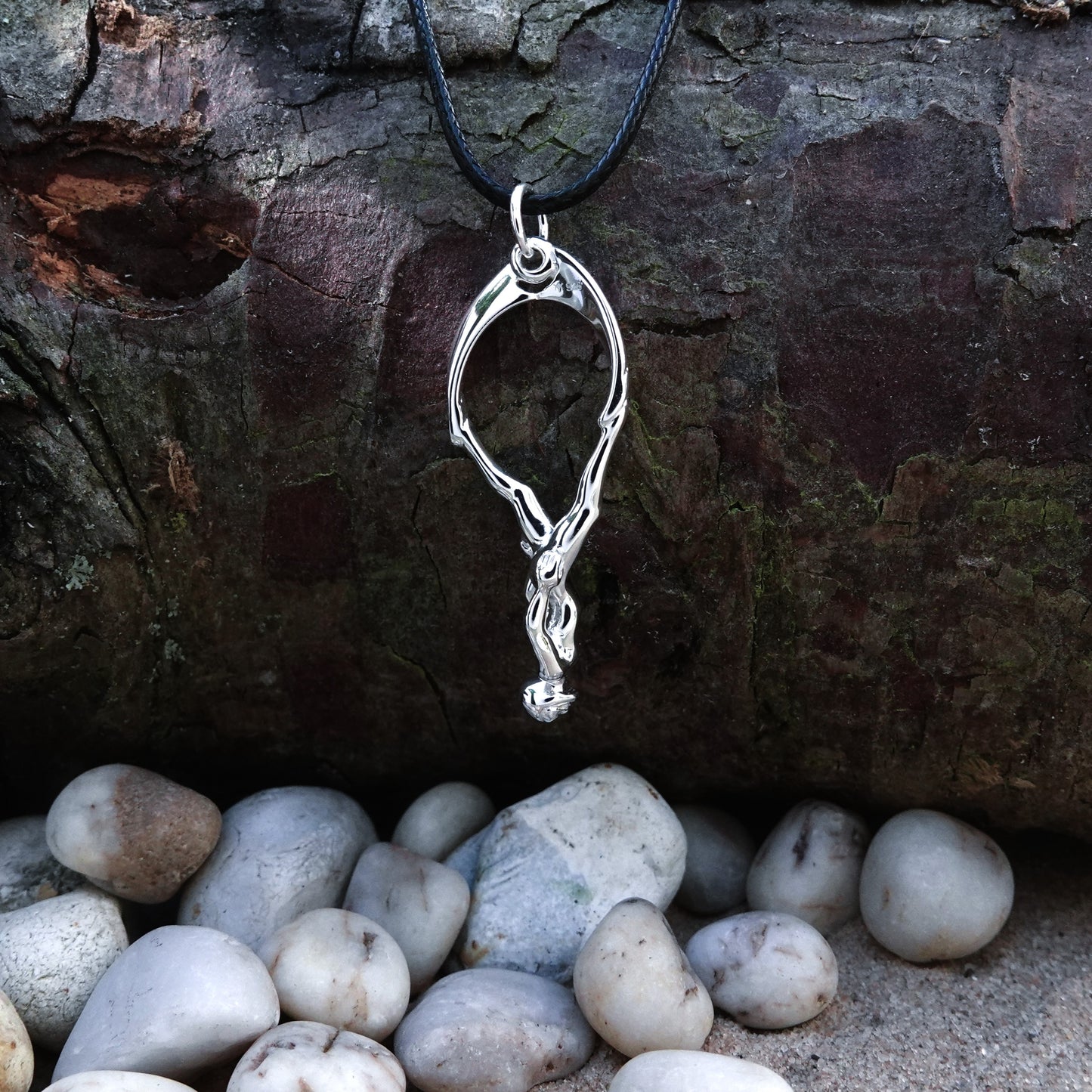Freediver necklace. Made from highly polished, tarnish resistant silver, strung on a strong cord. © Adrian Ashley