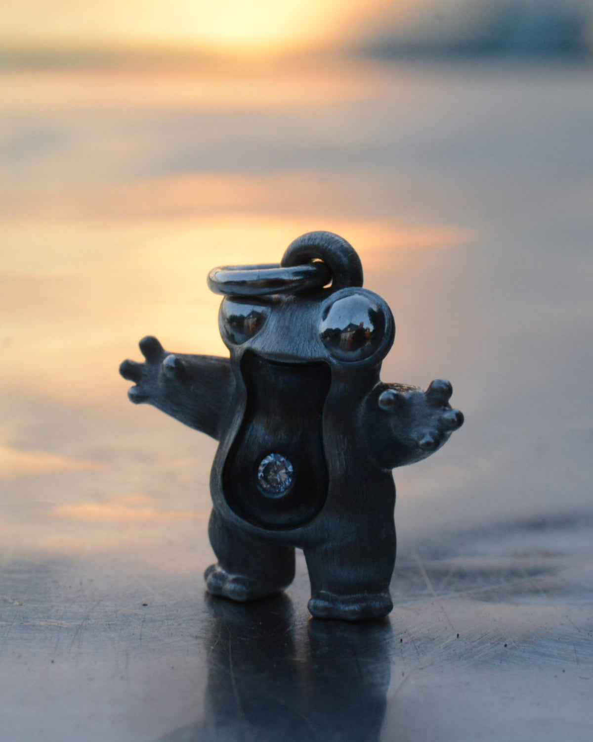 Frog type Bright Creature with a diamond and black rhodium.
