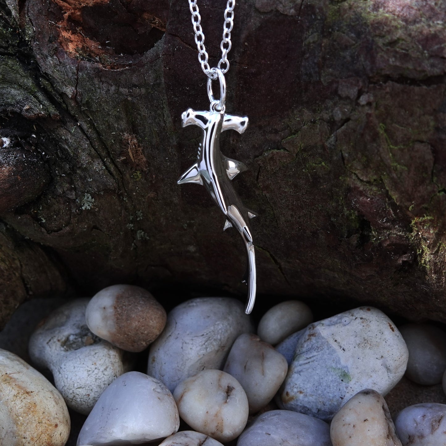 Hammerhead Shark necklace. Made from highly polished, tarnish resistant silver, hung on a solid silver chain. © Adrian Ashley
