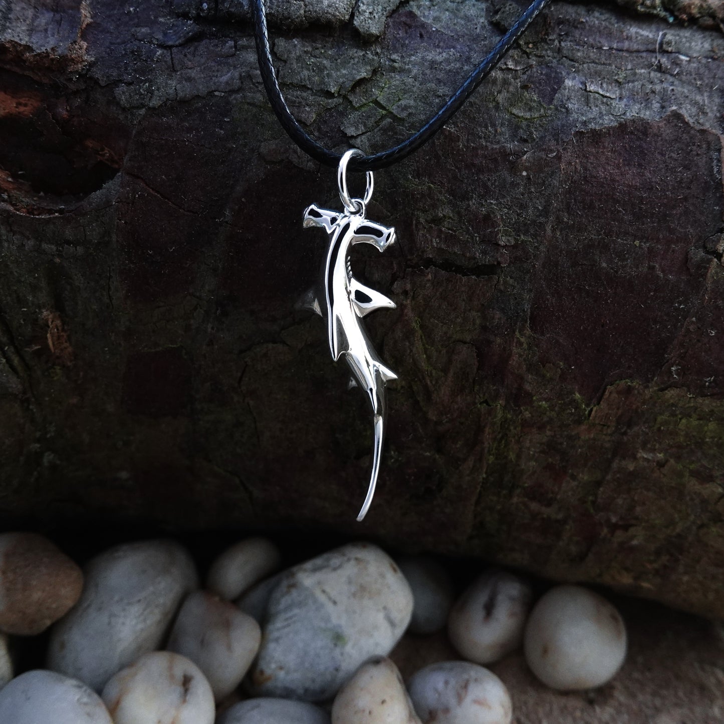 Hammerhead Shark necklace. Made from highly polished, tarnish resistant silver, strung on a strong cord. © Adrian Ashley