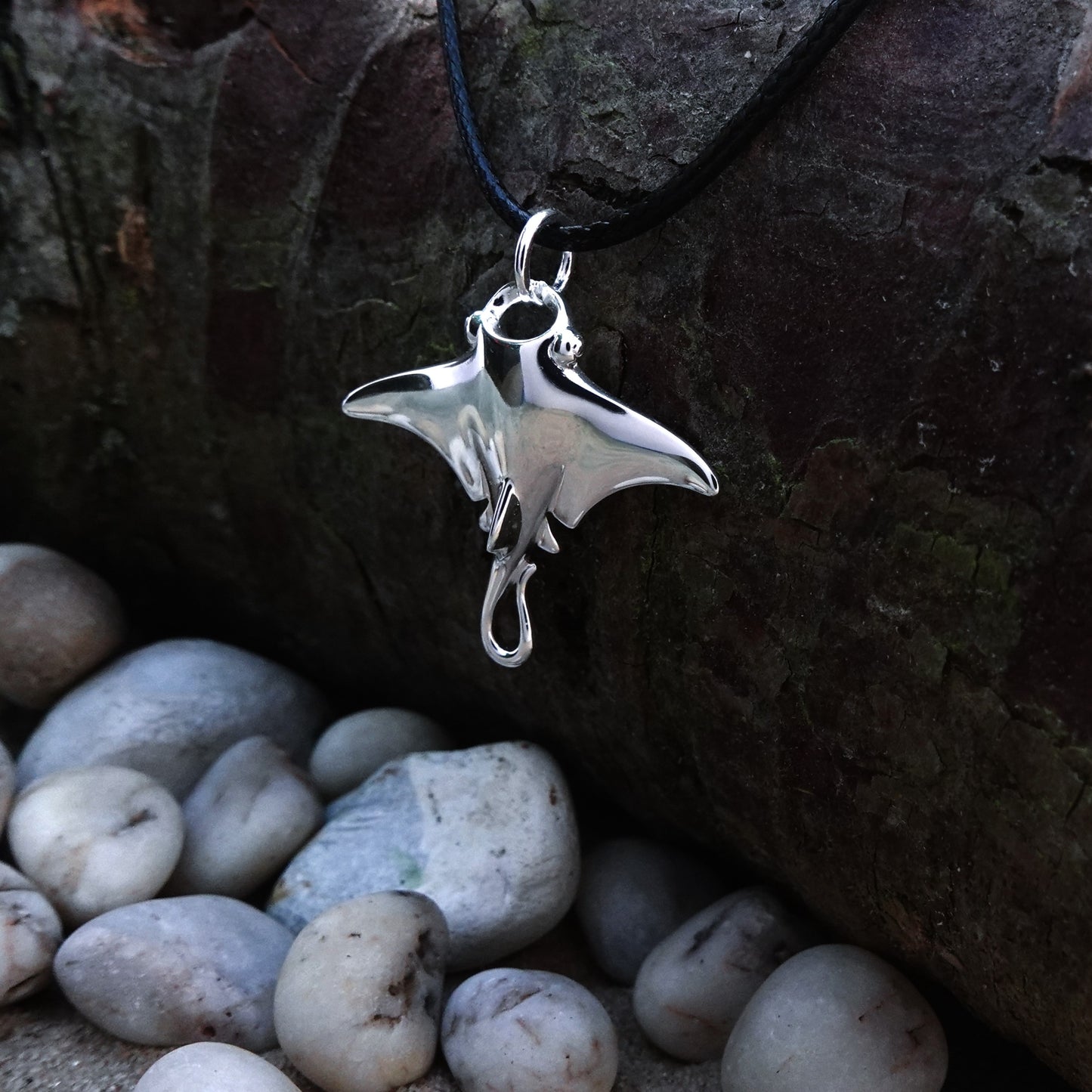 Manta Ray necklace. Made from highly polished, tarnish resistant silver, strung on a strong cord. © Adrian Ashley