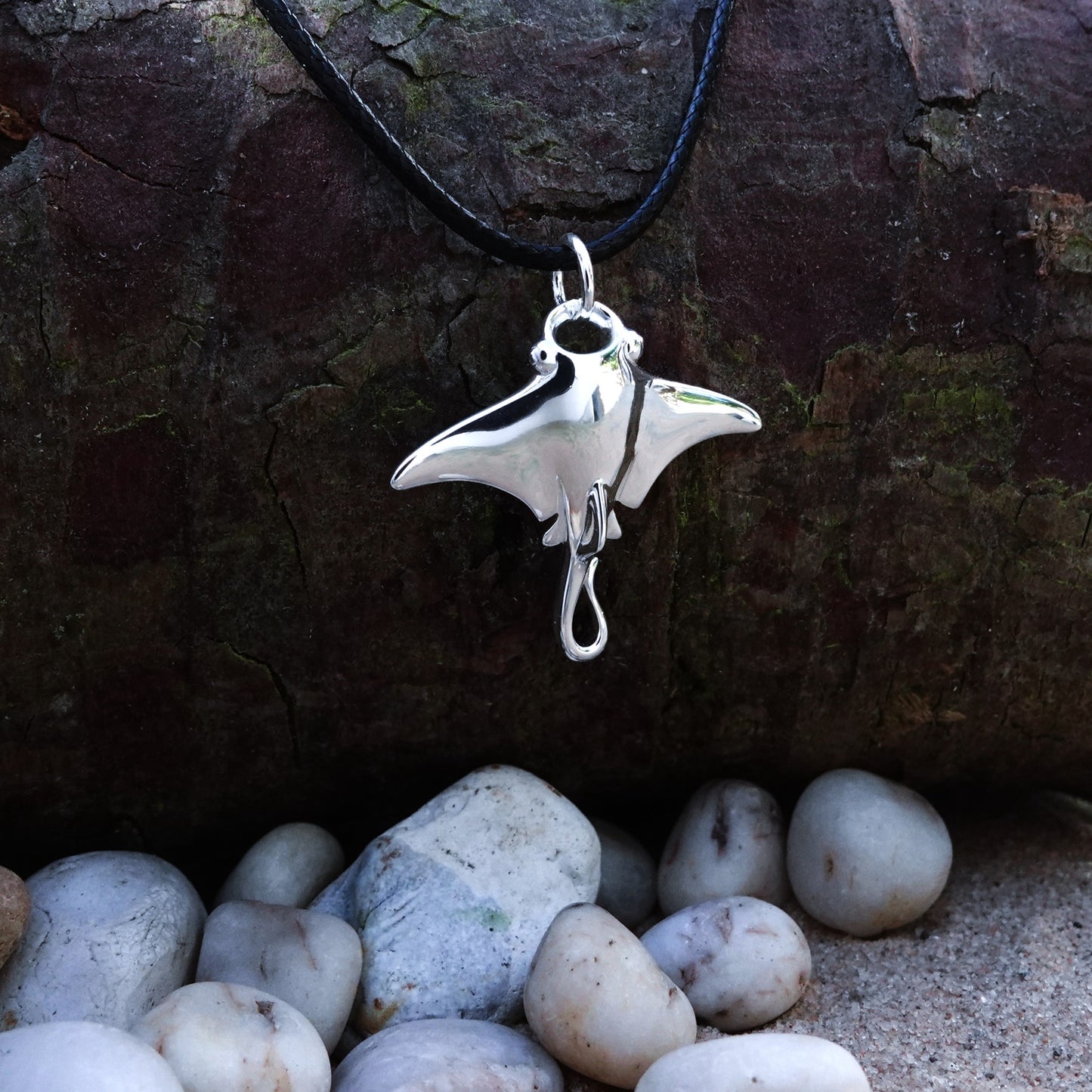 Manta Ray necklace. Made from highly polished, tarnish resistant silver, strung on a strong cord. © Adrian Ashley