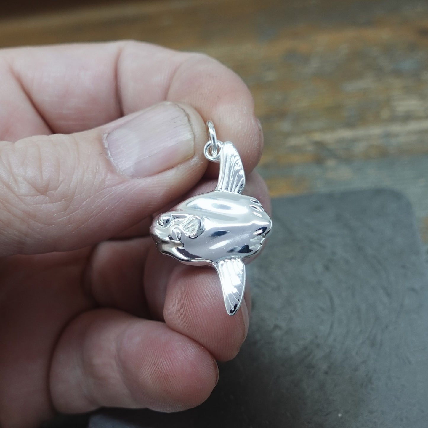 Mola Mola necklace. Made from highly polished, tarnish resistant silver, on a silver chain. © Adrian Ashley