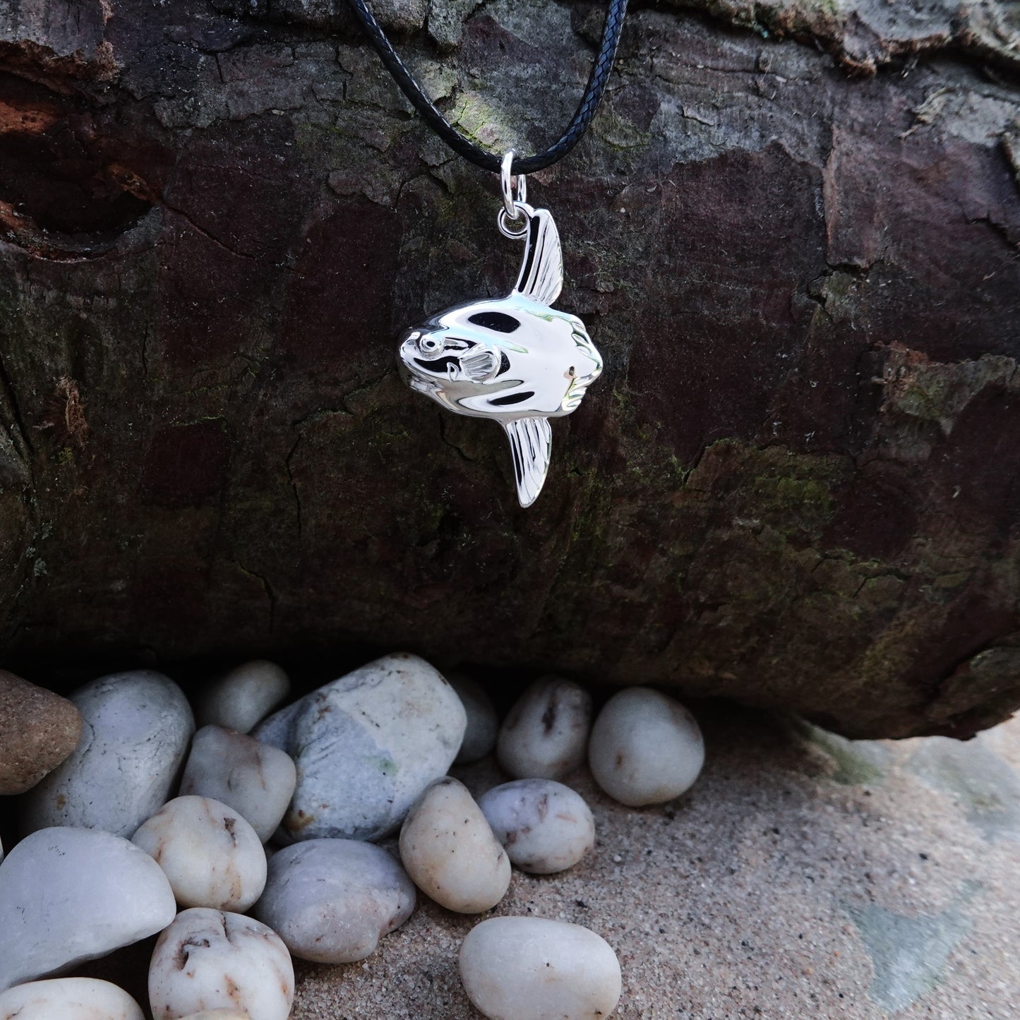 Mola Mola necklace. Made from highly polished, tarnish resistant silver, on a cord. © Adrian Ashley