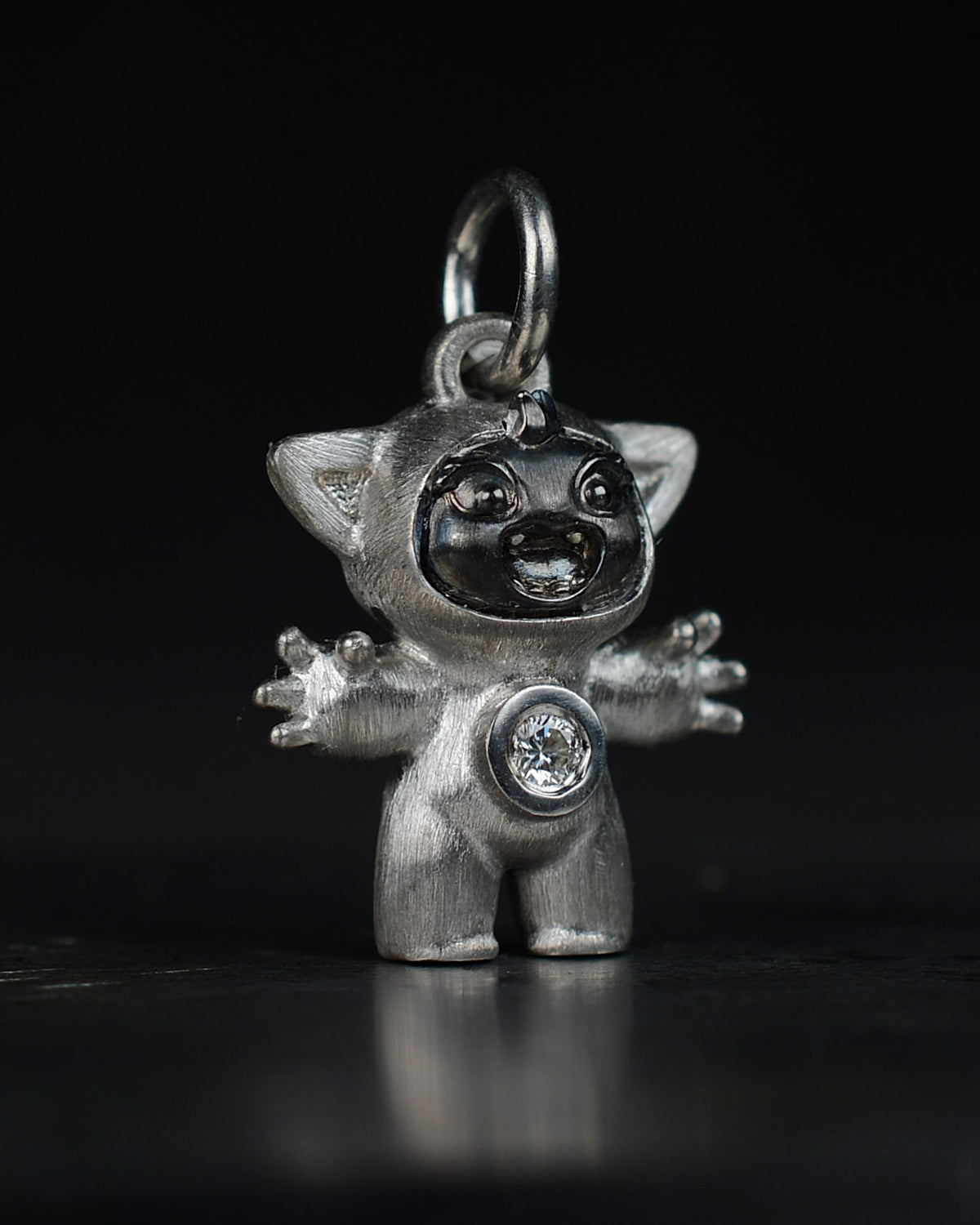 Noisy Bright Creature with black rhodium and a diamond-set belly.