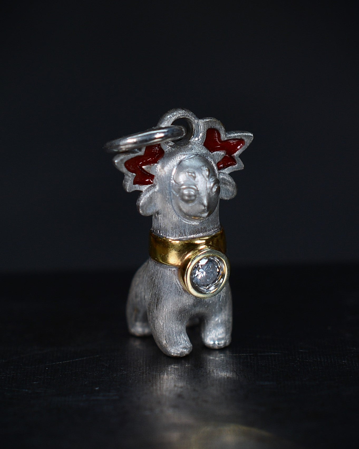Bright Creature with red antlers and a diamond and parcel gilt collar.