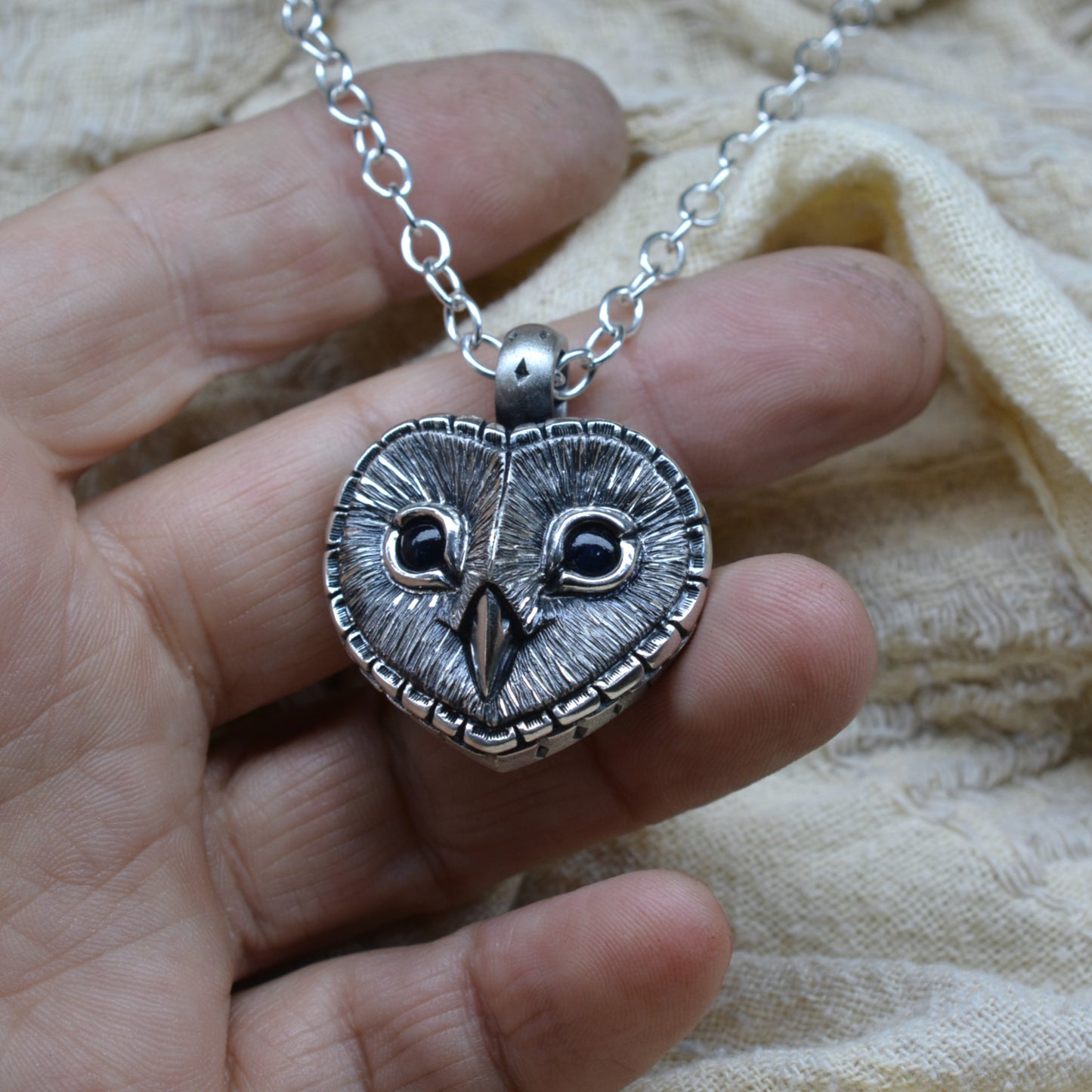 Midnight Blue sapphire Barn Owl necklace, large sterling silver owl pendant with dark blue eyes and a silver chain. Ready to be shipped © Adrian Ashley