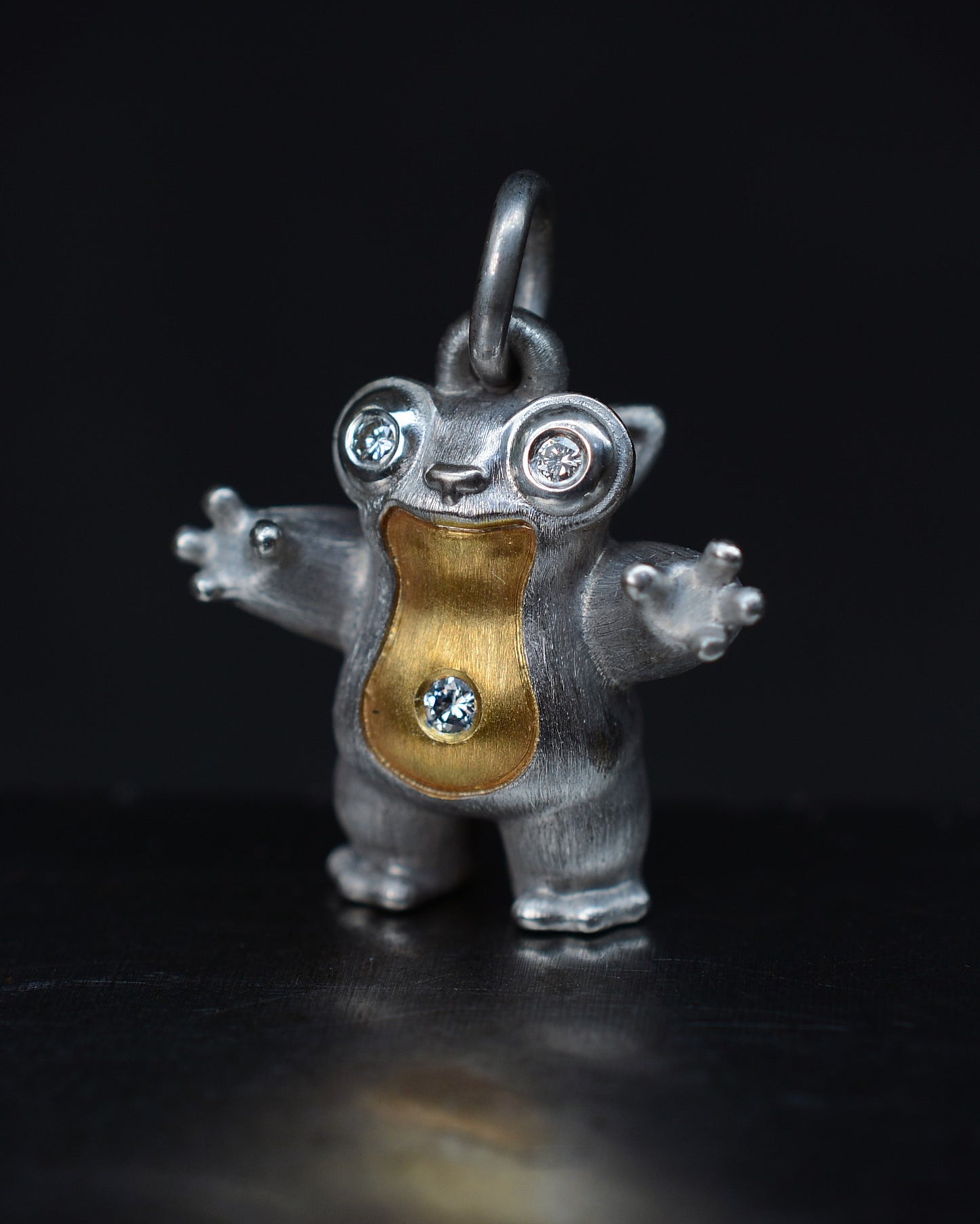 Tarsier Type Bright Creature with a diamond eyes and parcel gilt.