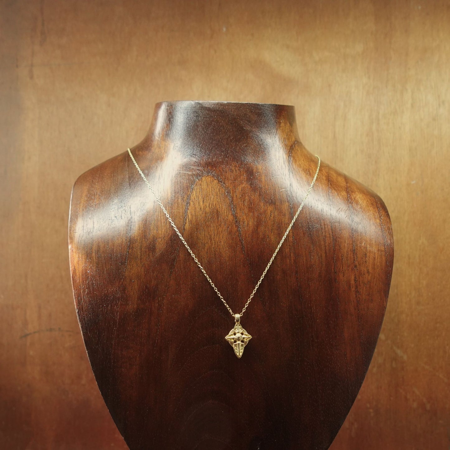 Gold vermeil Cross charm pendant and chain. © Adrian Ashley