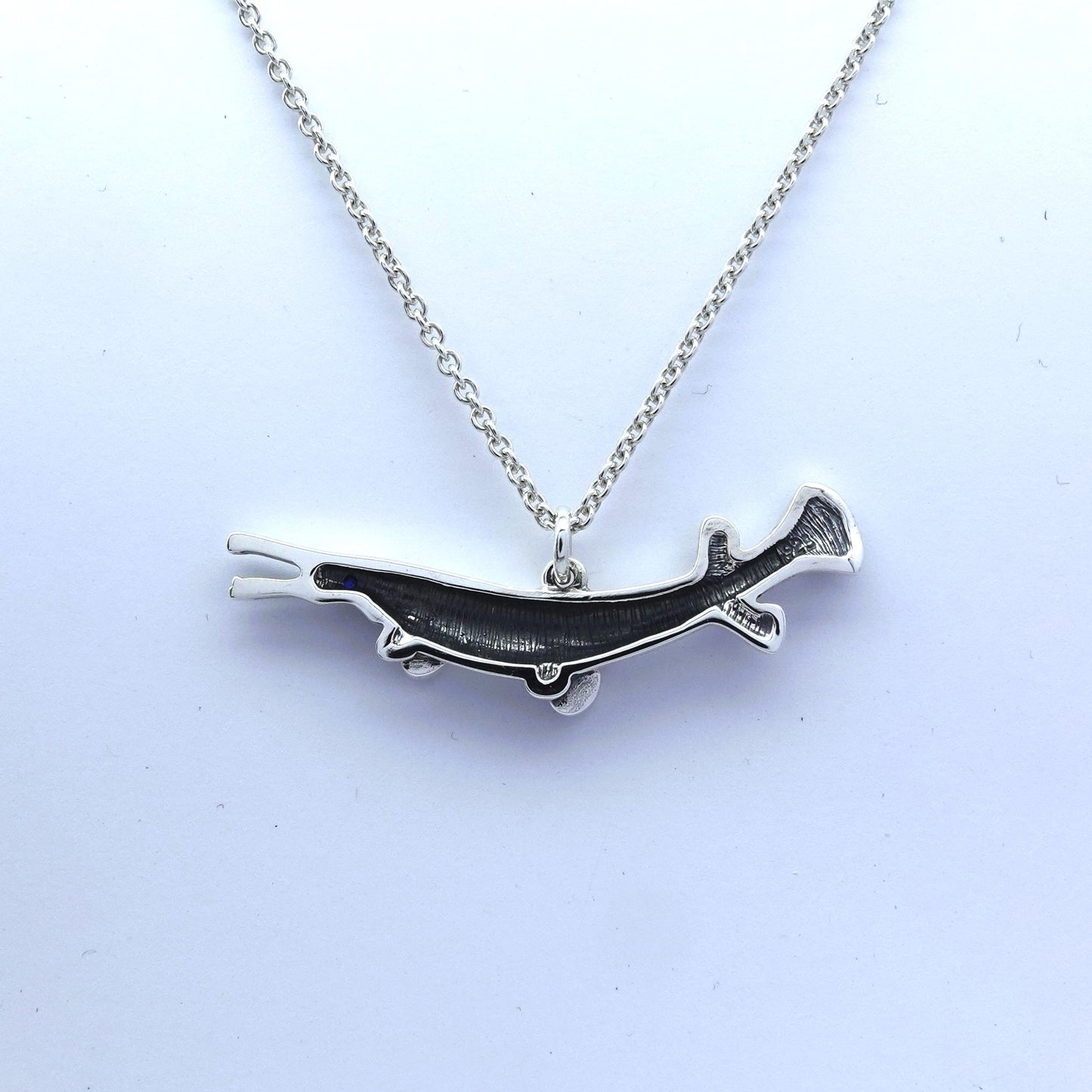 Gar pike necklace. Made from sterling silver with an antiqued finish, set with a gemstone eye. Alligator gar. Ideal fisherman’s gift