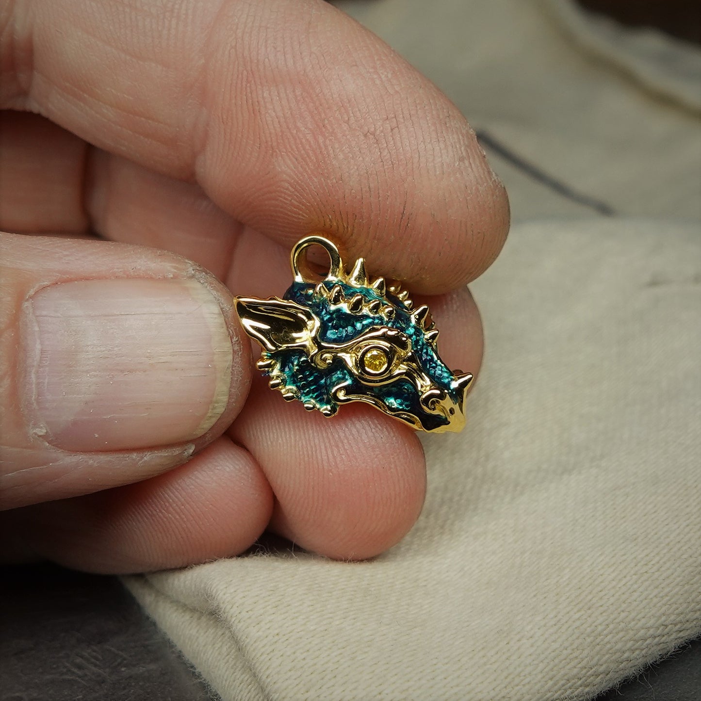Gold dragon's head with diamond eyes and a gold chain. Handmade to order. © Adrian Ashley
