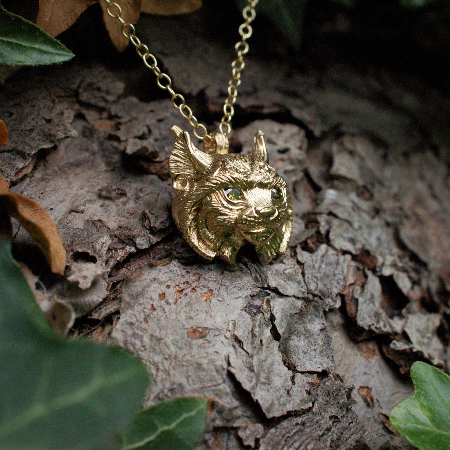Gold lynx head pendant with diamond eyes and a gold chain. *This piece is finished and ready to be shipped* © Adrian Ashley