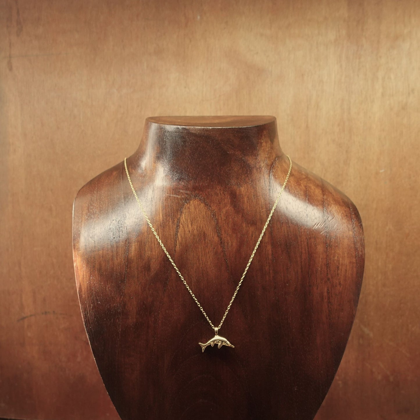 Gold vermeil Ichthyosaur charm pendant and chain. © Adrian Ashley