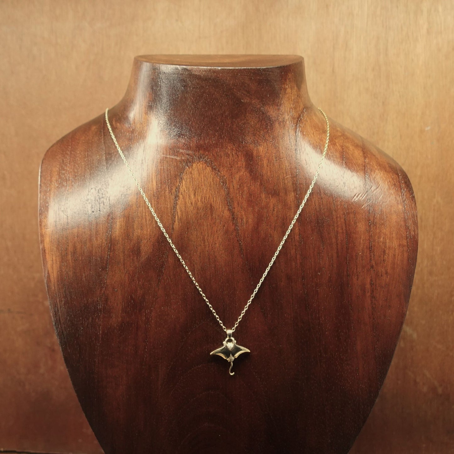 Gold vermeil Manta Ray charm pendant and chain. © Adrian Ashley
