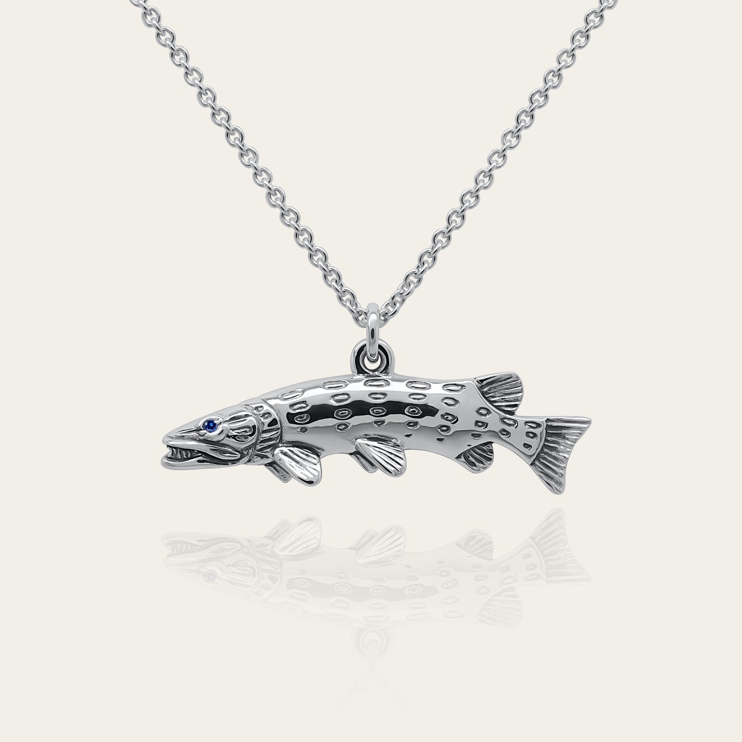 Pike fishing necklace. Made from sterling silver with an antiqued finish, set with a gemstone eye. Ideal fisherman’s angling gift © Adrian Ashley