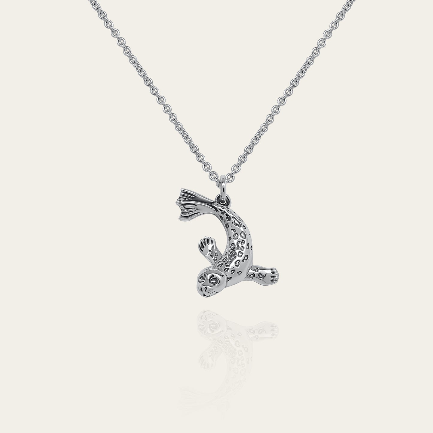 Seal necklace. Made from sterling silver with an antiqued finish. © Adrian Ashley