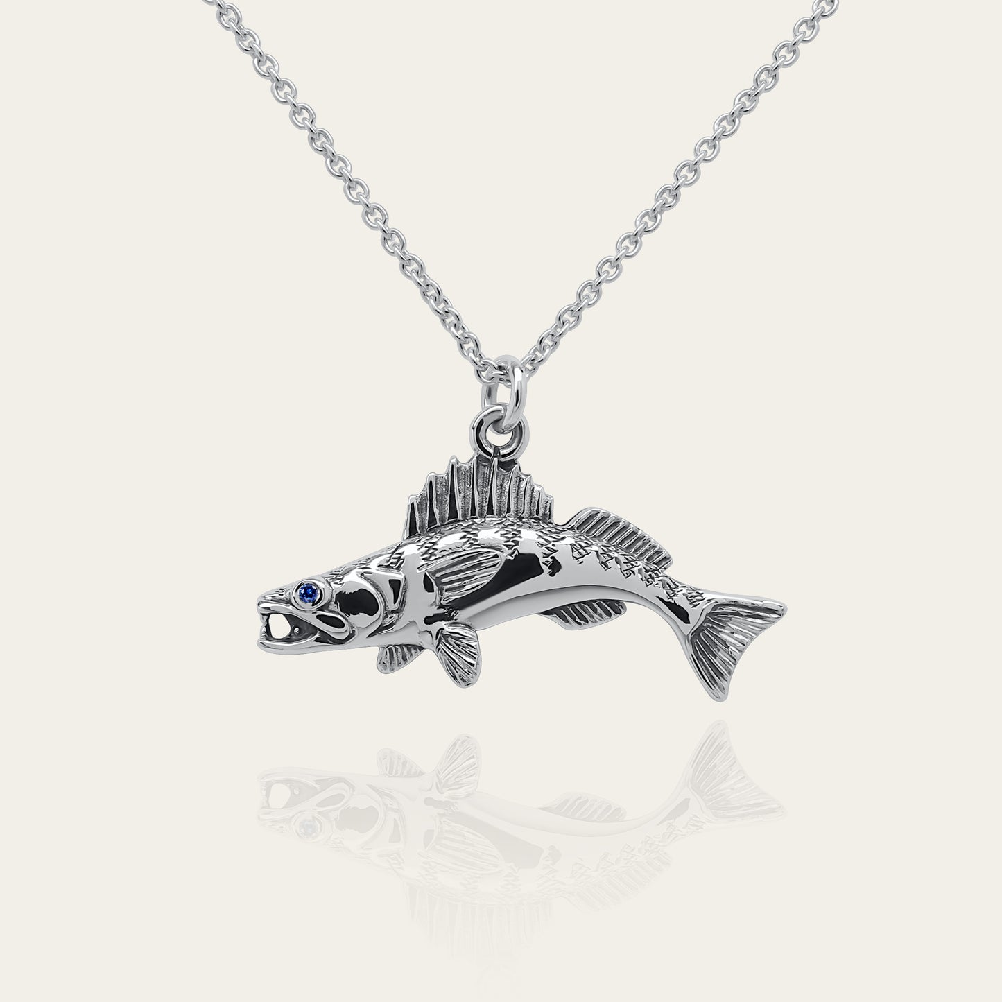 Zander fishing necklace. Made from sterling silver with an antiqued finish, set with a gemstone eye. Walleye pendant, ideal fisherman’s angling gift © Adrian Ashley