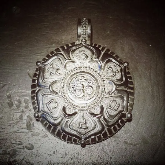 Chakra Mandala necklace, silver pendant and chain with a coloured patina and platinum coating, meditation, yoga or mindfulness amulet. © Adrian Ashley