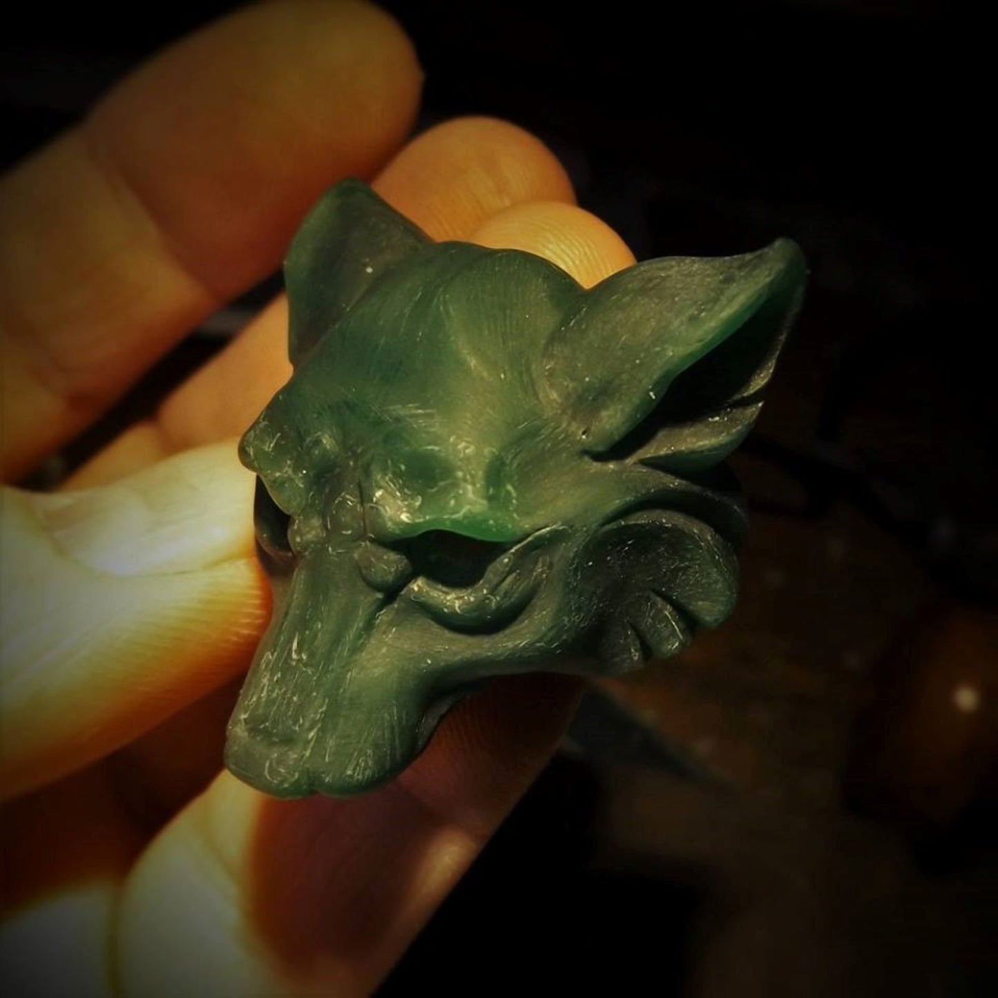 Dire Wolf Necklace. Sterling silver dire wolf's head pendant with blue topaz eyes and a silver chain. Ready to be shipped. © Adrian Ashley