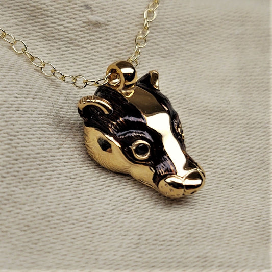 Gold badger Necklace, gold and natural sapphire pendant with a solid gold chain. This piece will be hand made for you in the UK. © Adrian Ashley