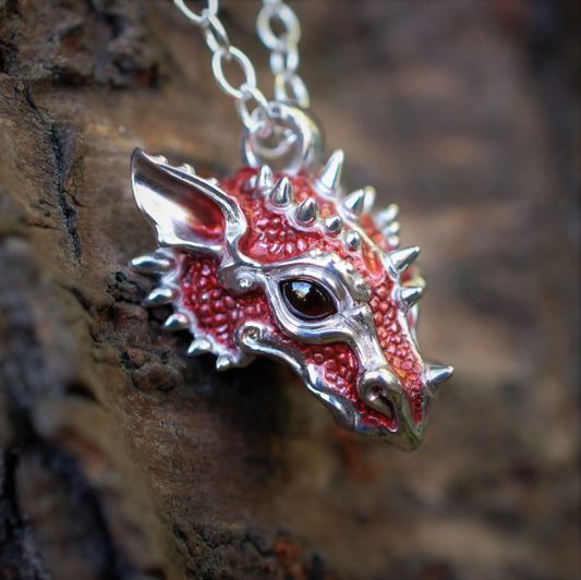 Red dragon necklace. Sterling silver dragon pendant, with natural garnet eyes and a solid silver chain. Made to order. © Adrian Ashley