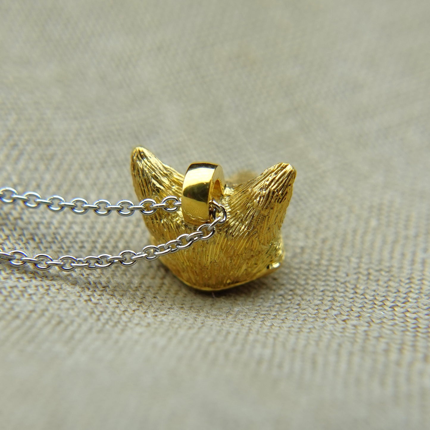 Solid 22ct gold fox pendant and platinum chain. Handmade to order. © Adrian Ashley