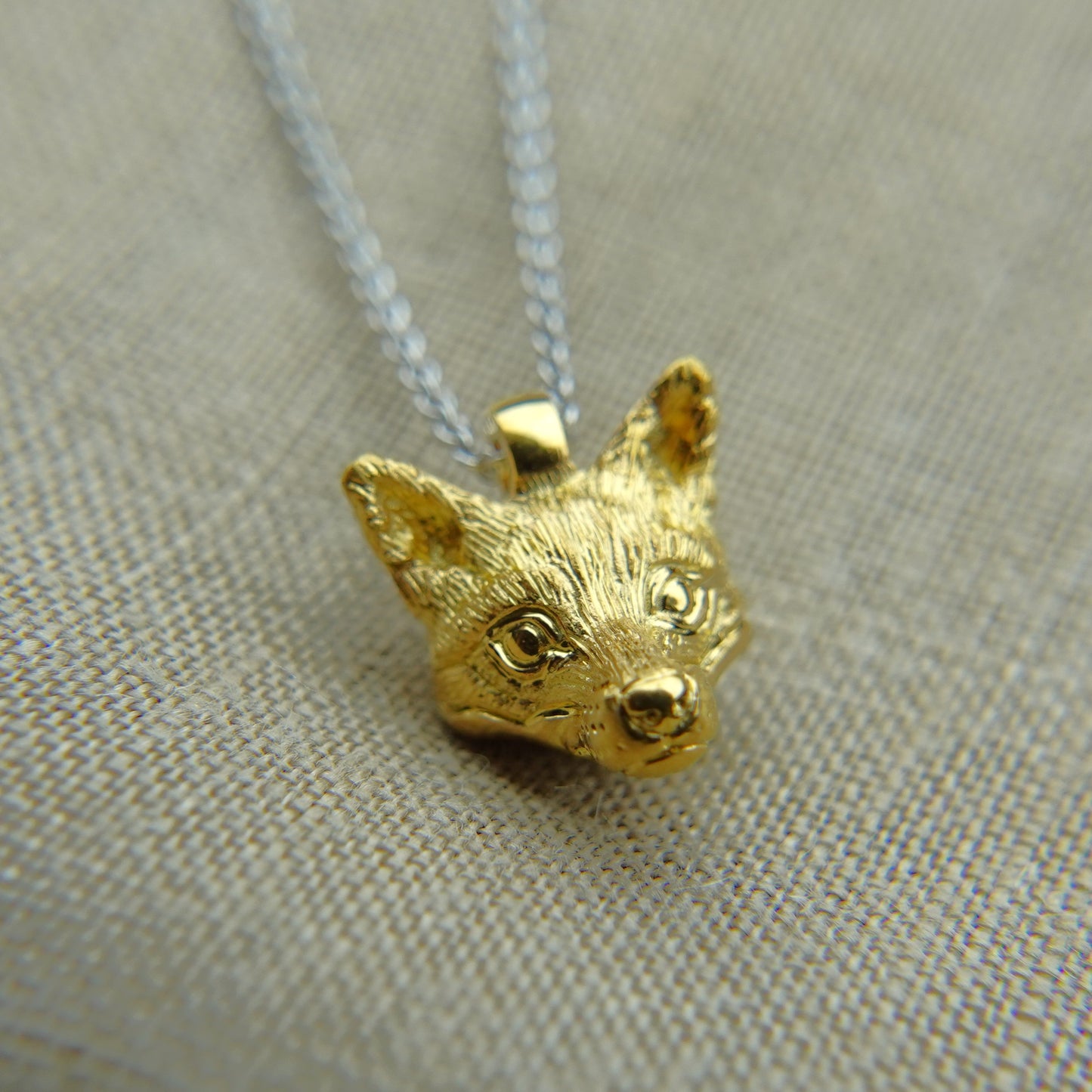 Solid 22ct gold fox pendant and platinum chain. Handmade to order. © Adrian Ashley