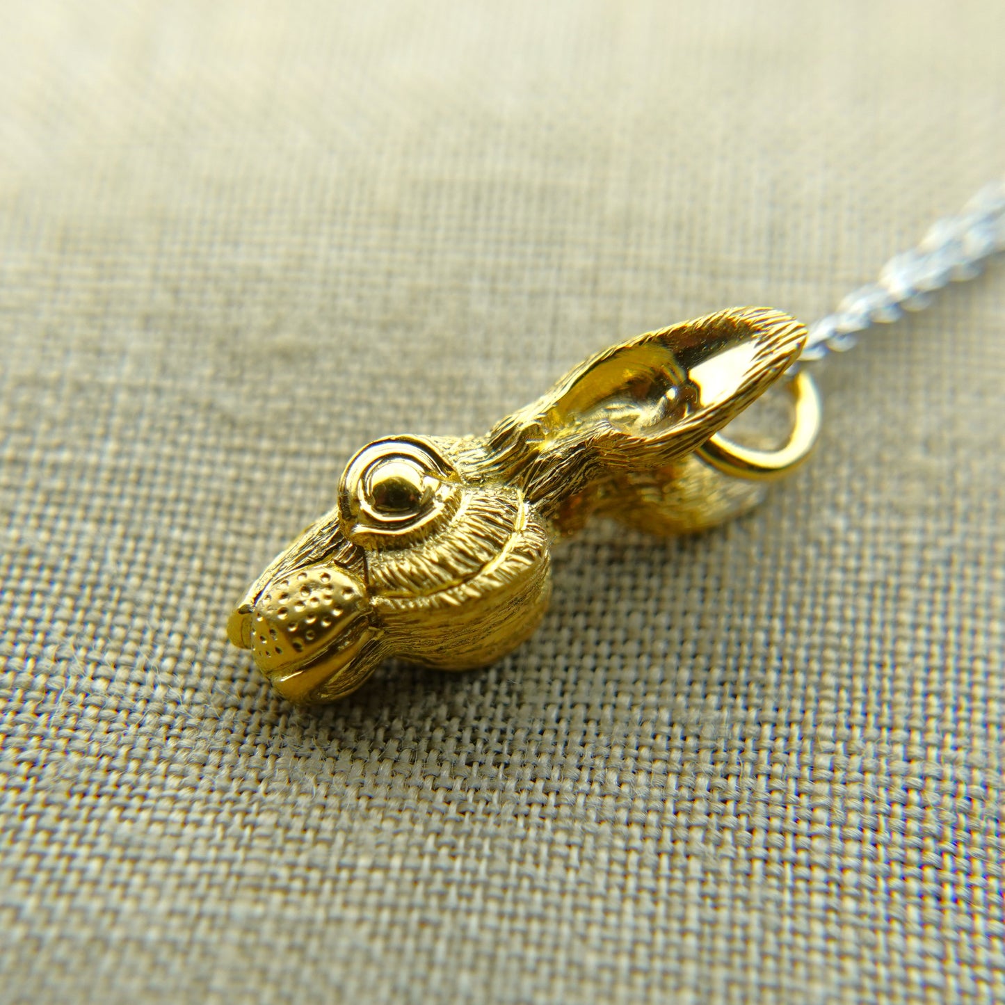 Solid 22ct gold hare pendant and platinum chain. Handmade to order. © Adrian Ashley