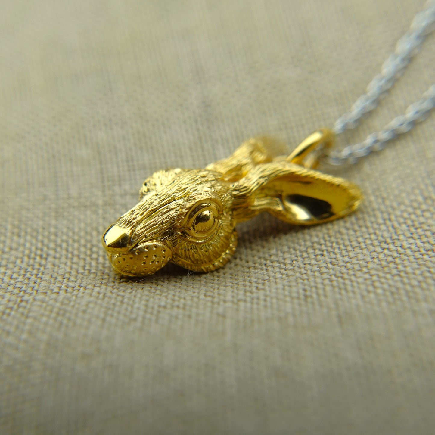 Solid 22ct gold hare pendant and platinum chain. Handmade to order. © Adrian Ashley