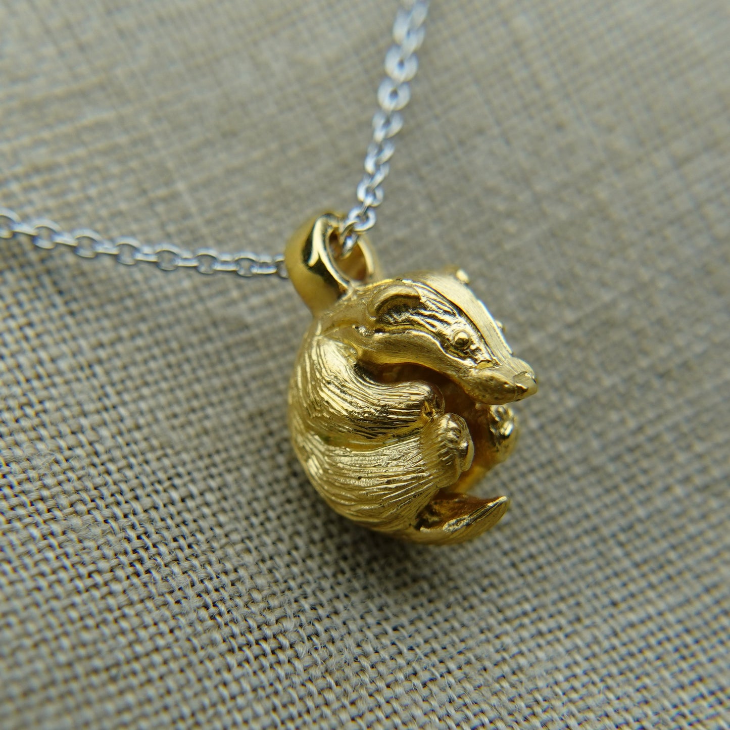 Solid 22ct gold badger pendant and platinum chain. Handmade to order. © Adrian Ashley