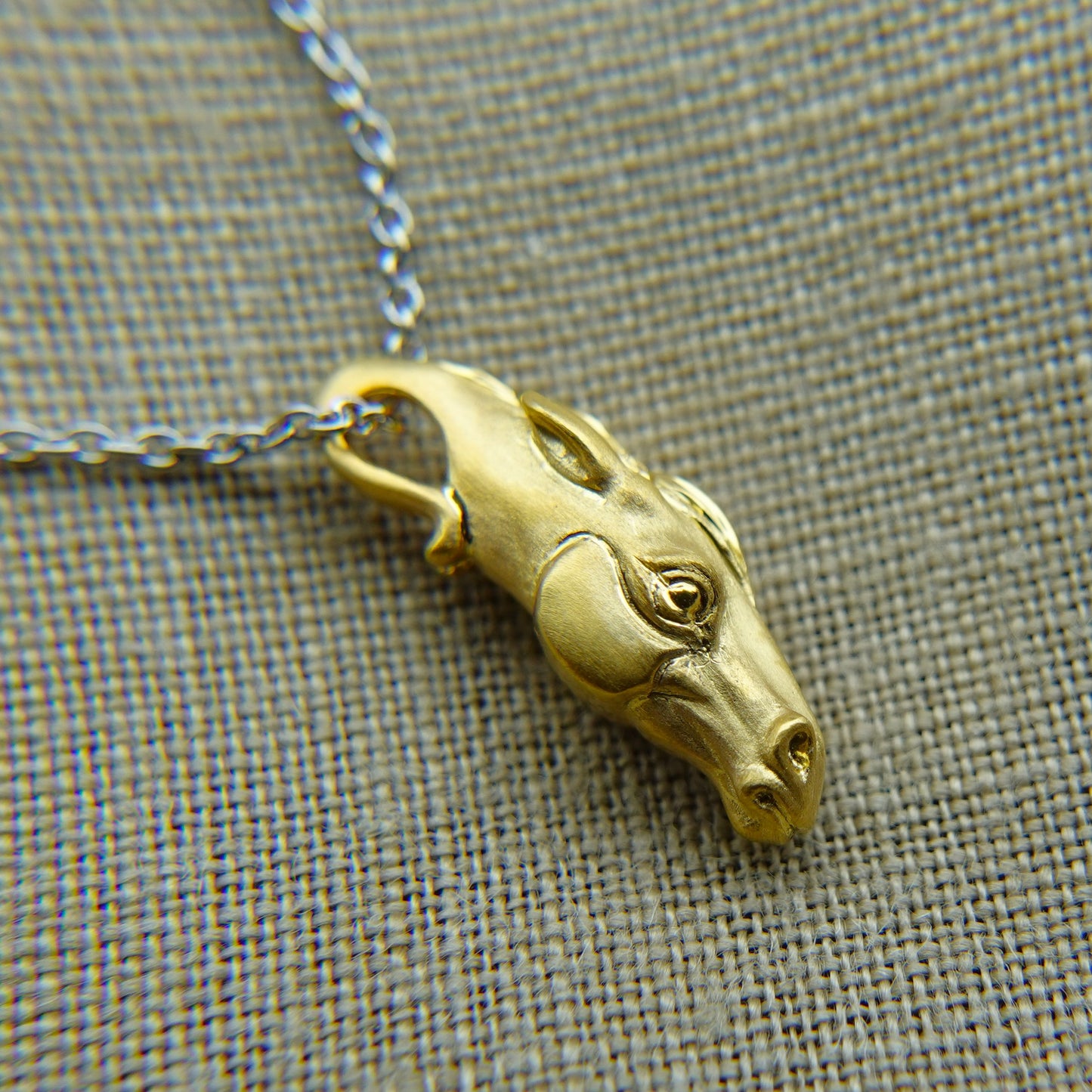 Solid 22ct gold horse pendant and platinum chain. Handmade to order. © Adrian Ashley