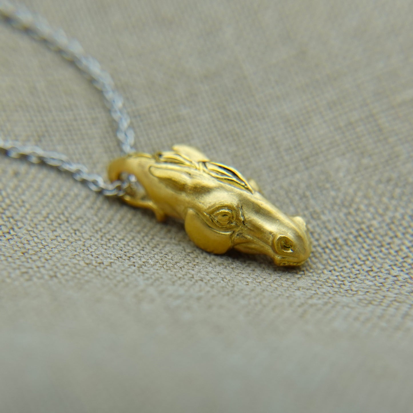 Solid 22ct gold horse pendant and platinum chain. Handmade to order. © Adrian Ashley