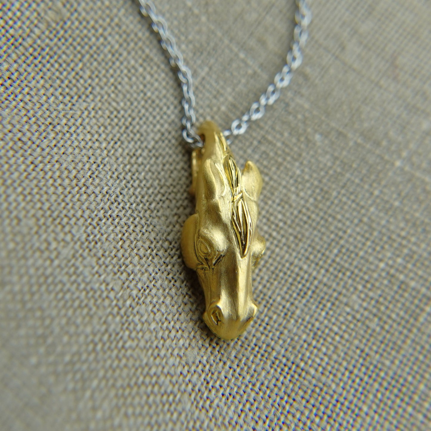 Solid 22ct gold horse pendant and platinum chain. Handmade to order. © Adrian Ashley