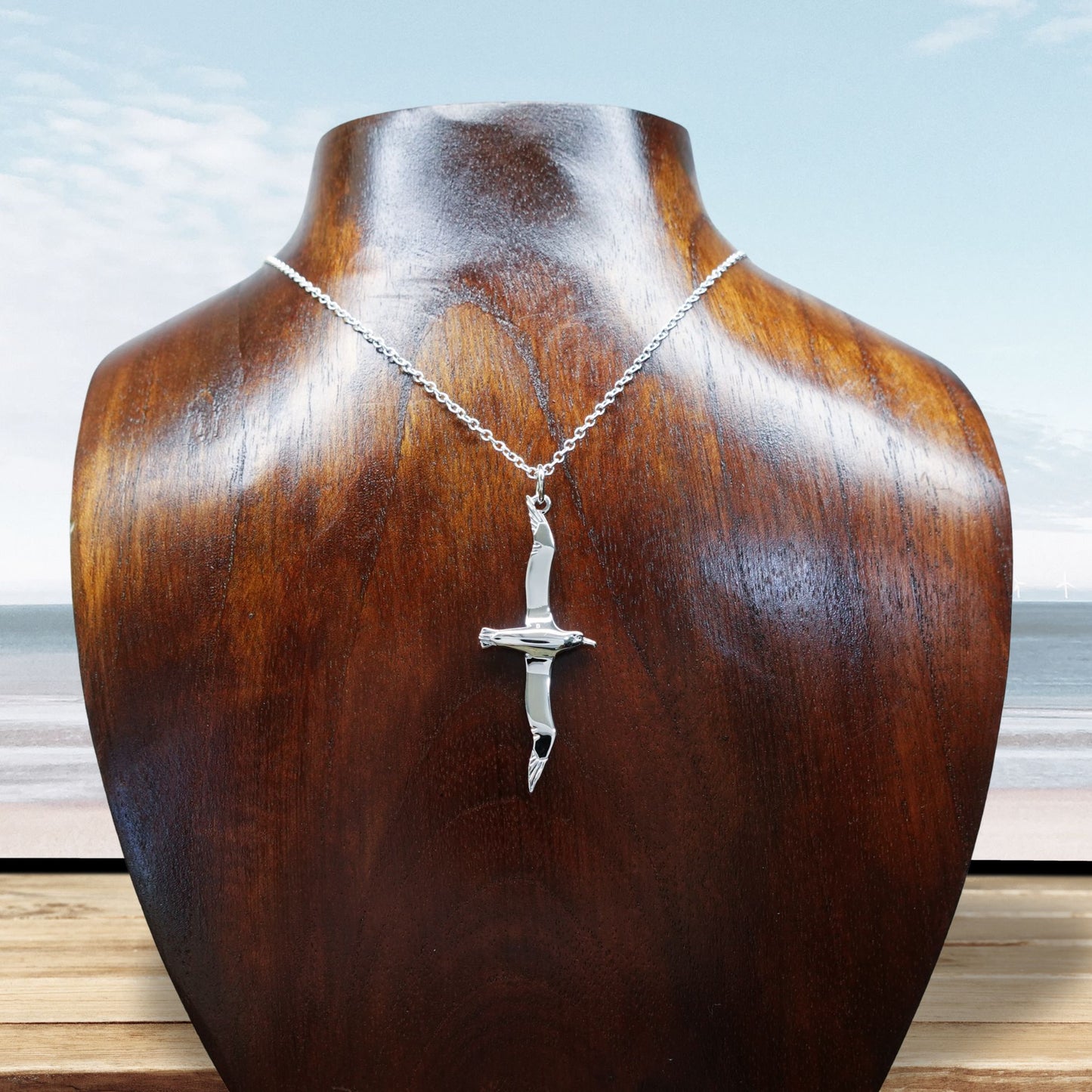 Albatross necklace. Made from highly polished, tarnish resistant silver, hung on a solid silver chain. © Adrian Ashley