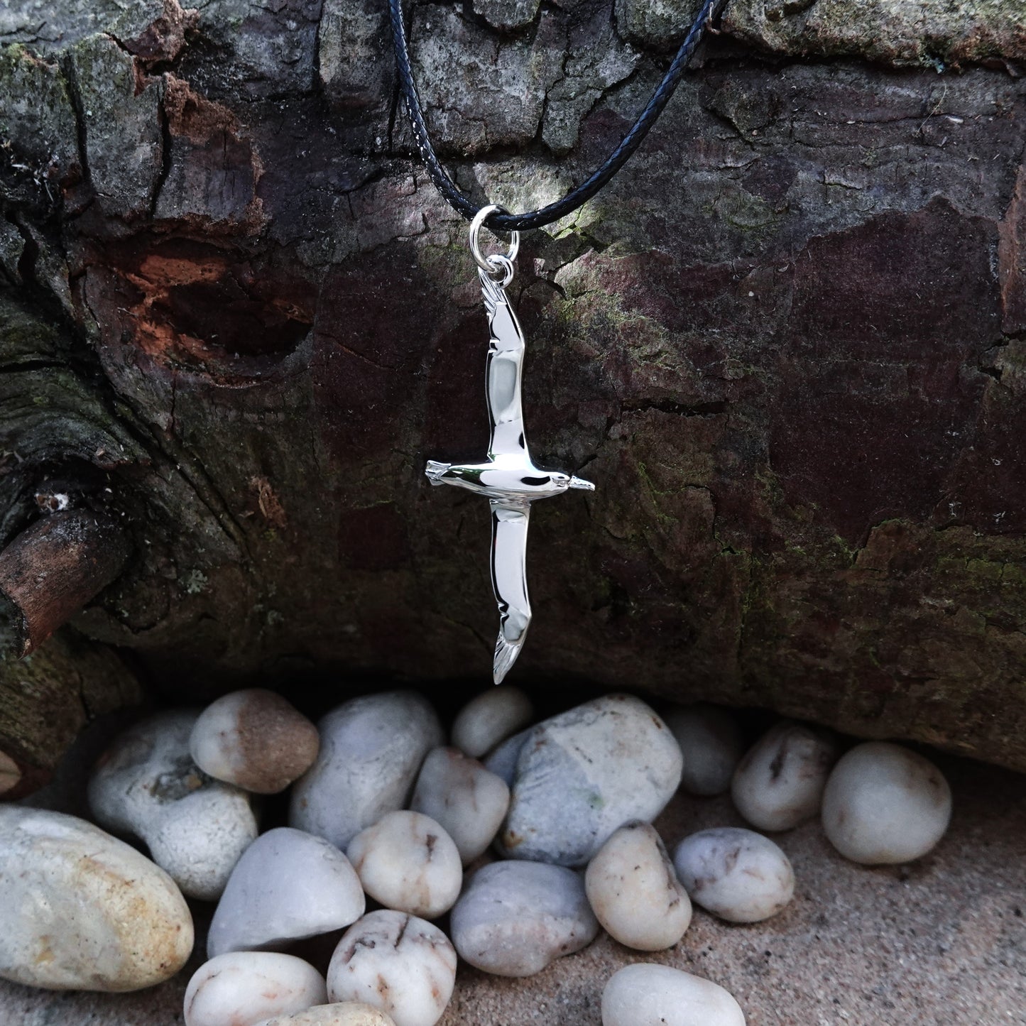 Albatross necklace. Made from highly polished, tarnish resistant silver, strung on a strong cord. © Adrian Ashley