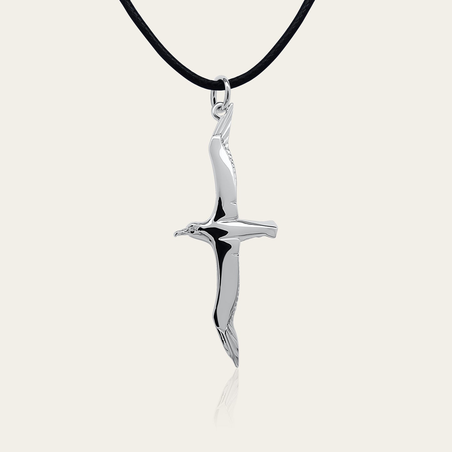 Albatross necklace. Made from highly polished, tarnish resistant silver, strung on a strong cord. © Adrian Ashley