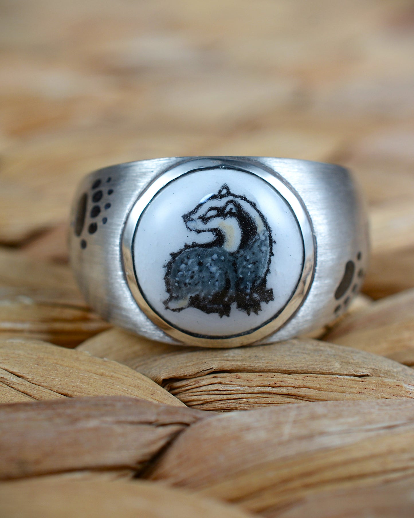 Enamelled badger and enamel footprints ring