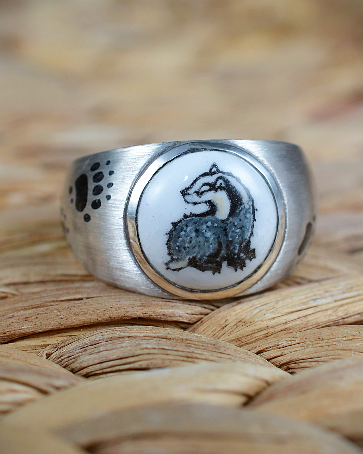 Enamelled badger and enamel footprints ring