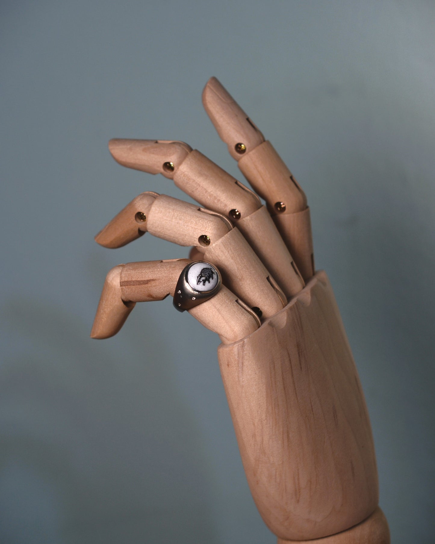 Enamelled badger ring set with diamonds