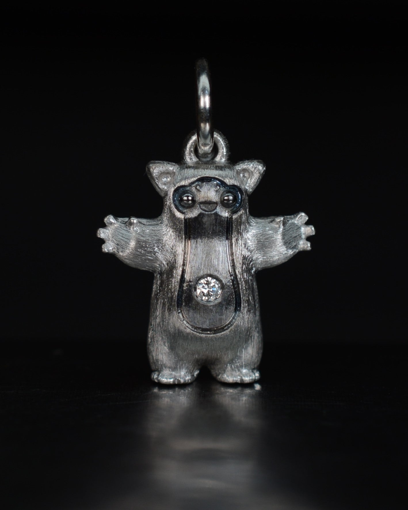 Fox eared pearshape small Bright Creature with a diamond and black rhodium.
