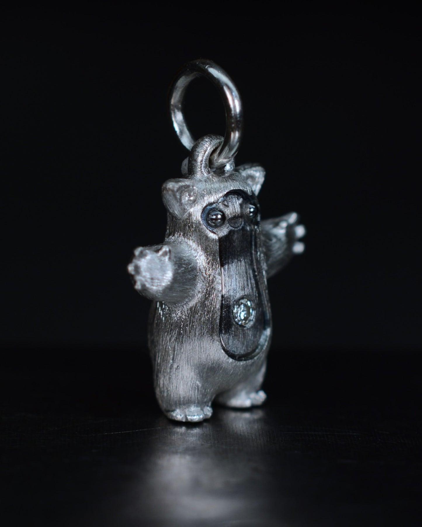 Fox eared pearshape small Bright Creature with a diamond and black rhodium.